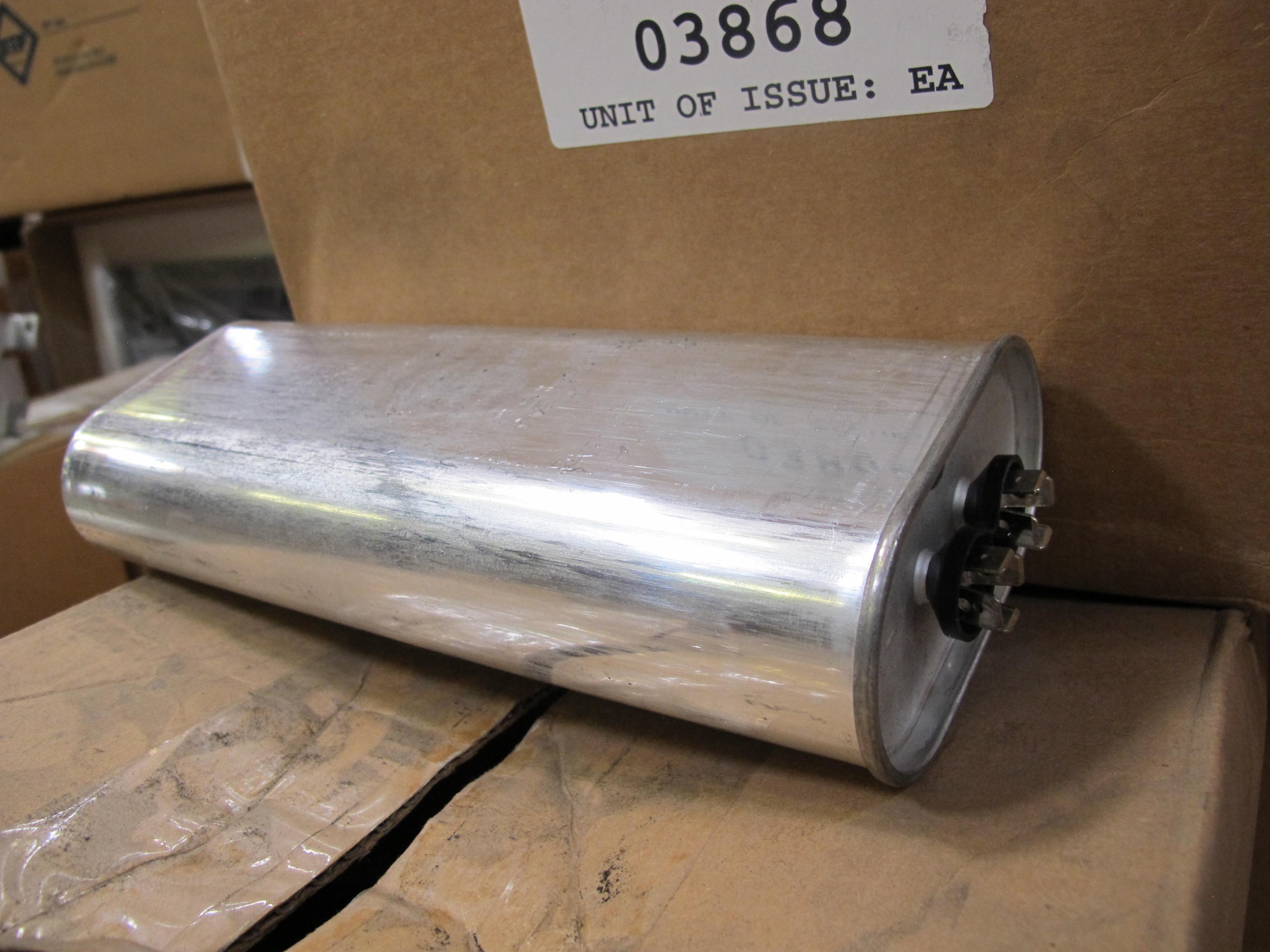 LOT TO INCLUDE: (76) CAPACITORS, FIXED TYPE, 13 UF CAPACITANCE, 1000 VAC VOLTAGE, PAPER/POLYPROPYLENE FILM/FOIL MATERIAL, (1) LIGHT, SPOTLIGHT KIND.. LOADING & HANDLING FEE $15-4143